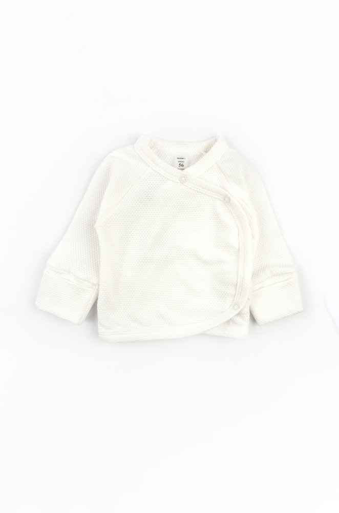 Newborn outfit: cotton gown, footed pants, and hat for the first days