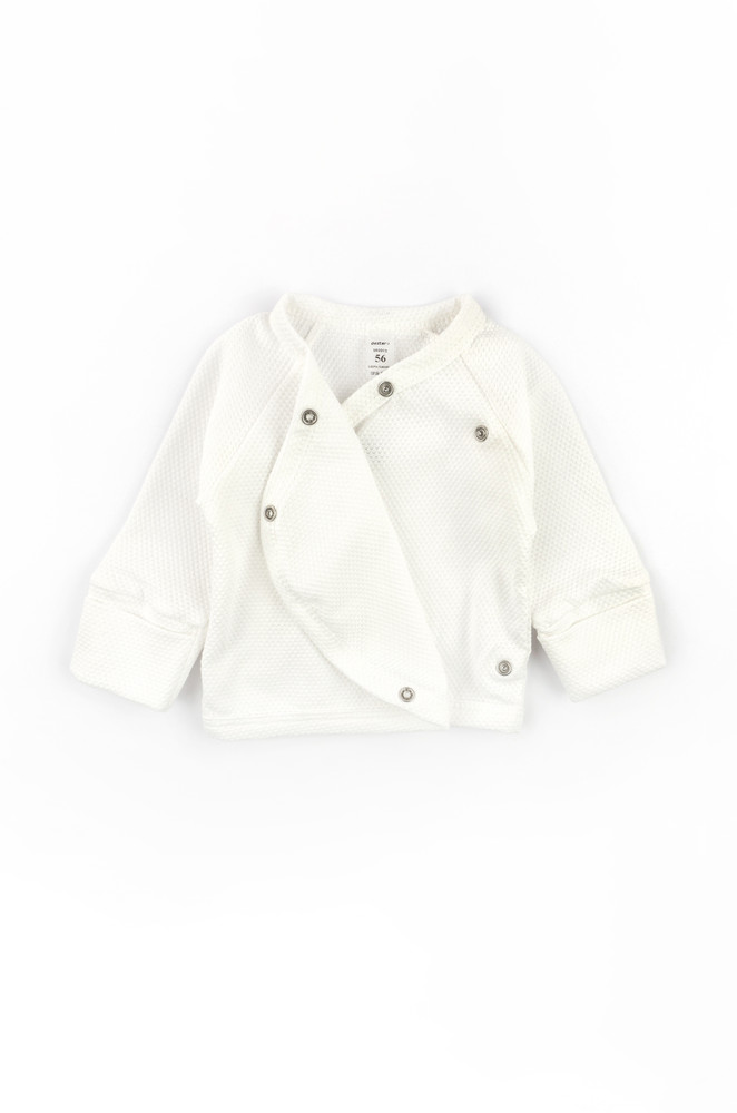 Newborn outfit: cotton gown, footed pants, and hat for the first days