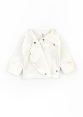 Newborn outfit: cotton gown, footed pants, and hat for the first days